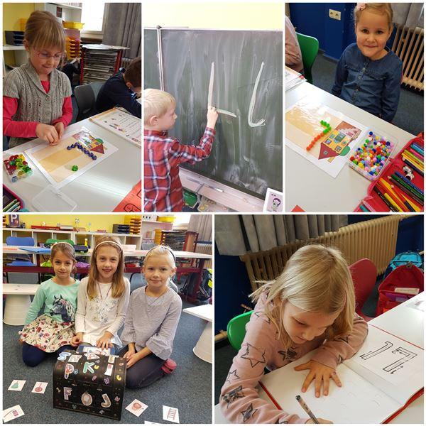 Erstklässler lernen fleißig die ersten Buchstaben und Zahlen kennen